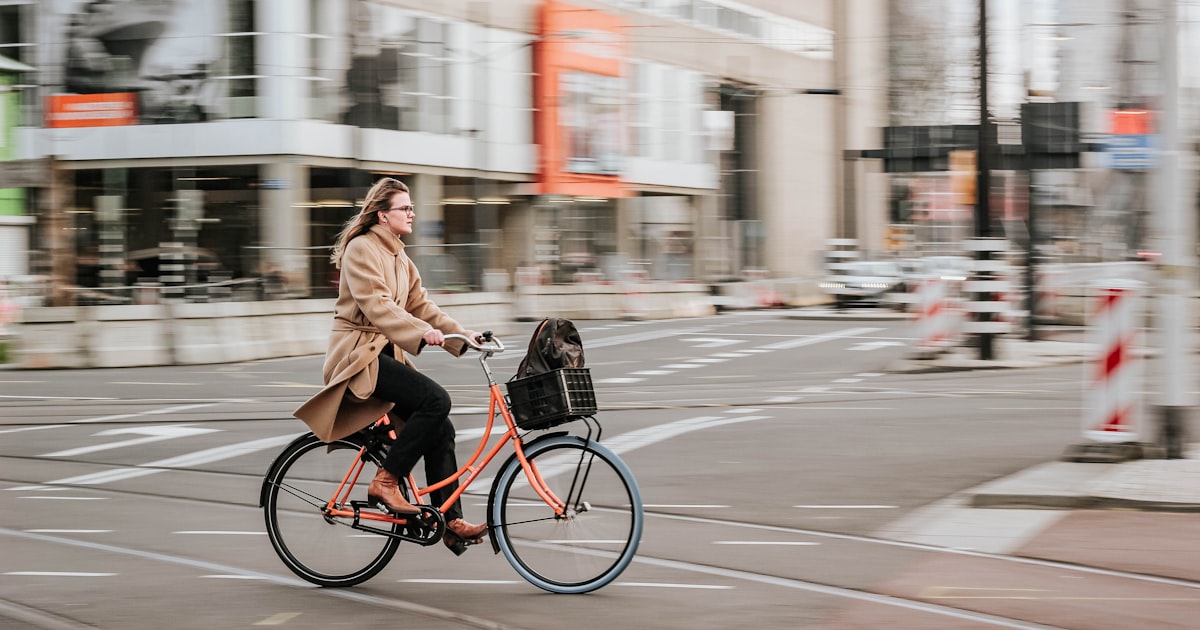 Cyclist riding on a Cleveland city street during the summer commuting season