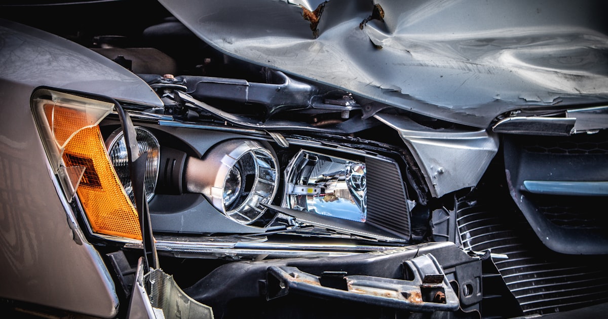 A Cleveland driver reviewing auto insurance paperwork for uninsured motorist coverage after a hit-and-run
