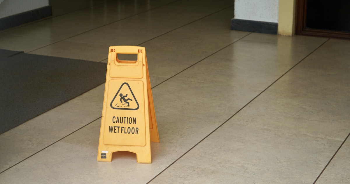 A wet, freshly mopped store floor that poses a slip and fall risk in Cleveland