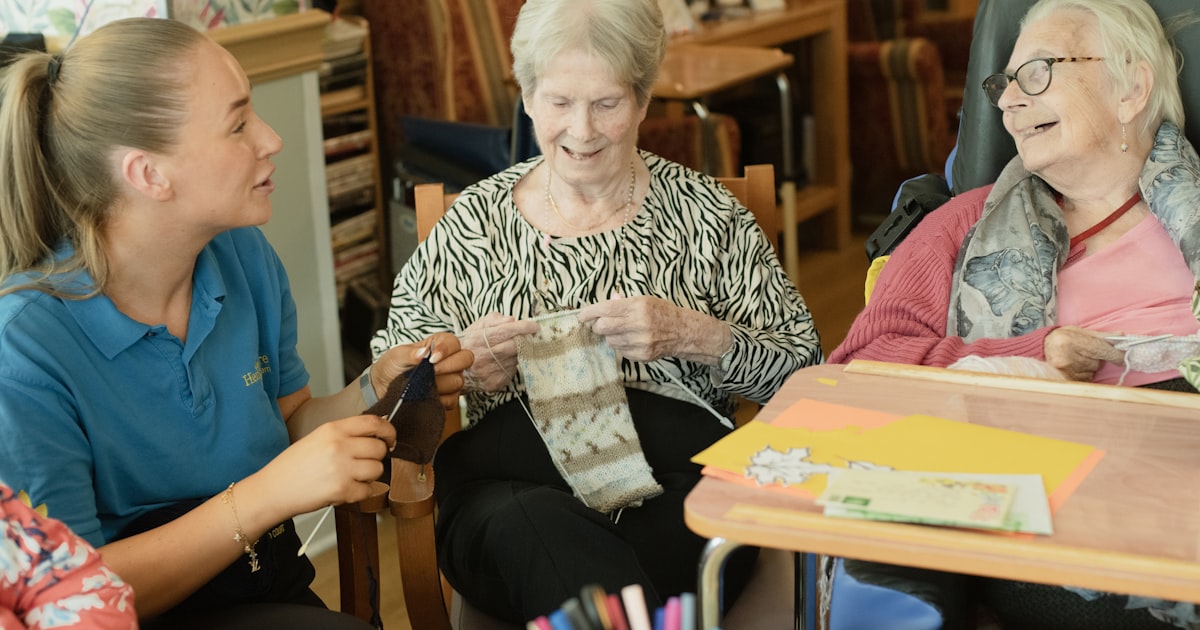 A caregiver assisting an elderly resident, representing the attentive staffing that understaffed Ohio nursing homes often lack
