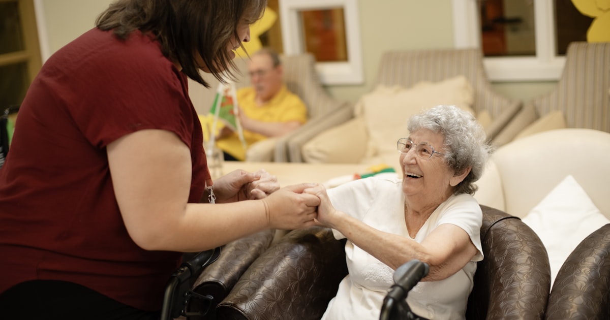 Hands of an older person resting on a walking aid, symbolizing fall and pressure injury risks in Cleveland nursing homes