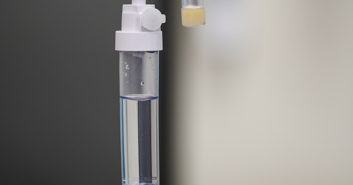 Pharmacist reviewing antibiotic dosing and blood level results in a hospital pharmacy