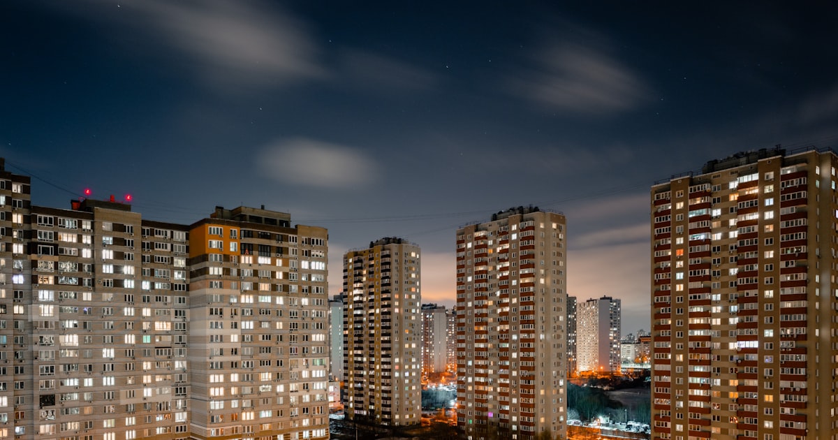 Dimly lit apartment parking area at night where inadequate lighting and security can lead to injury