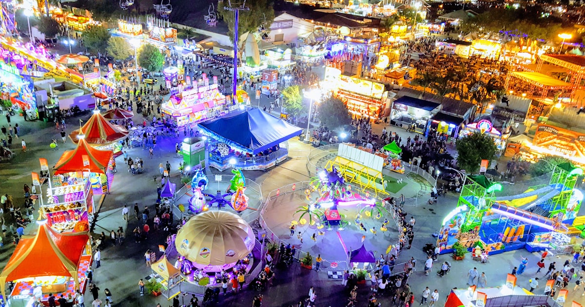 Crowd of visitors enjoying a summer county fair in Ohio