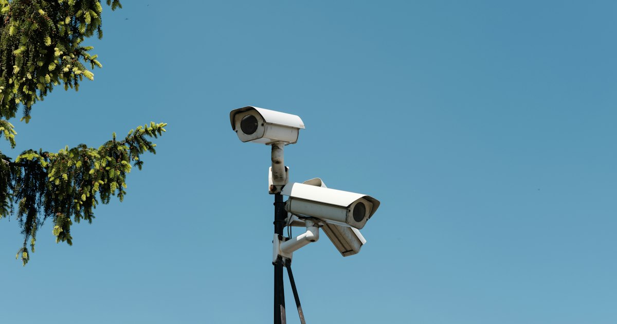 Bank of surveillance monitors, the kind of AI-driven security that property owners rely on to prevent crime
