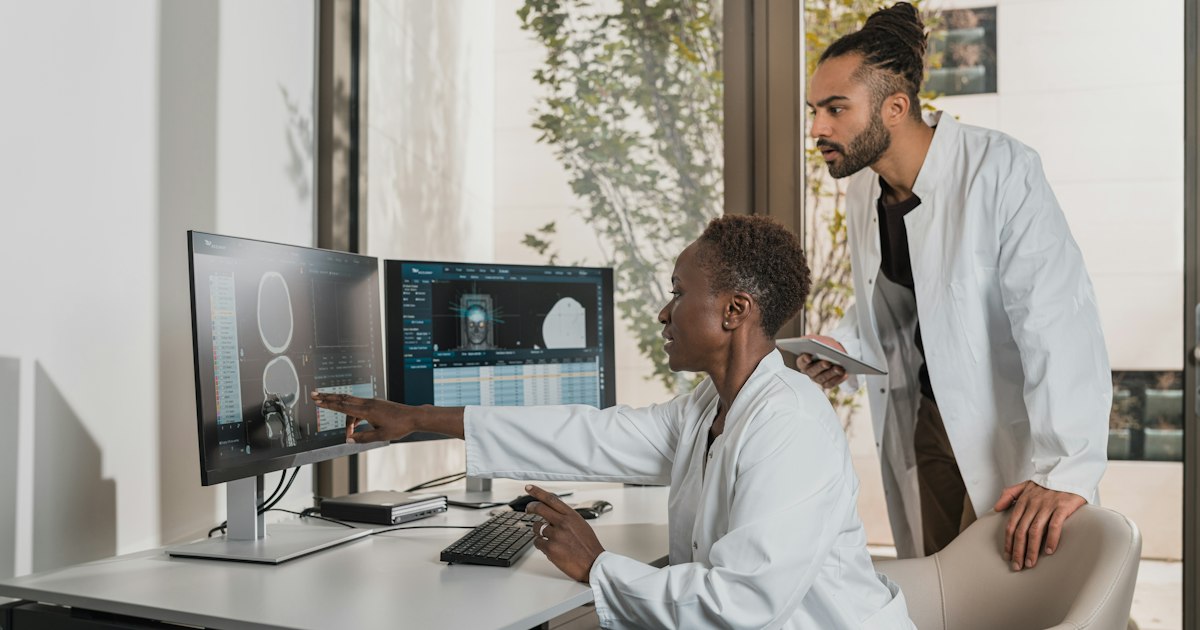 Physician reviewing medical scans that an AI system helped interpret at a Cleveland hospital