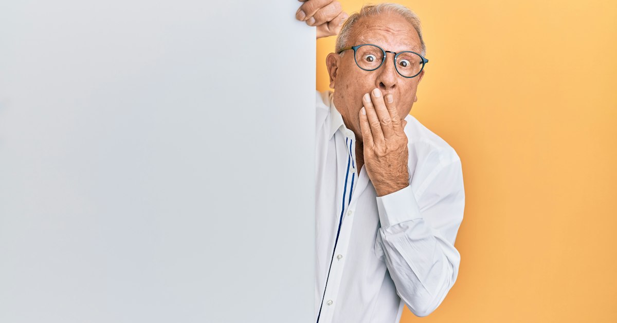 Older Ohio resident reviewing financial documents after a suspected scam, a common target of organized fraud rings