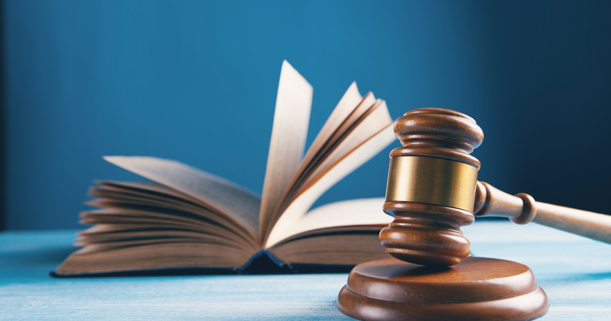 Attorney reviewing legal documents at a Cleveland law office while building a civil corrupt-activity claim