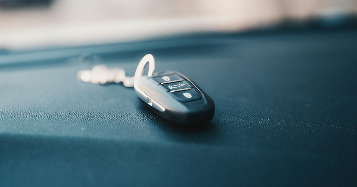 Car keys resting on a table beside a drink, a reminder that the choice to drive impaired leaves lasting harm