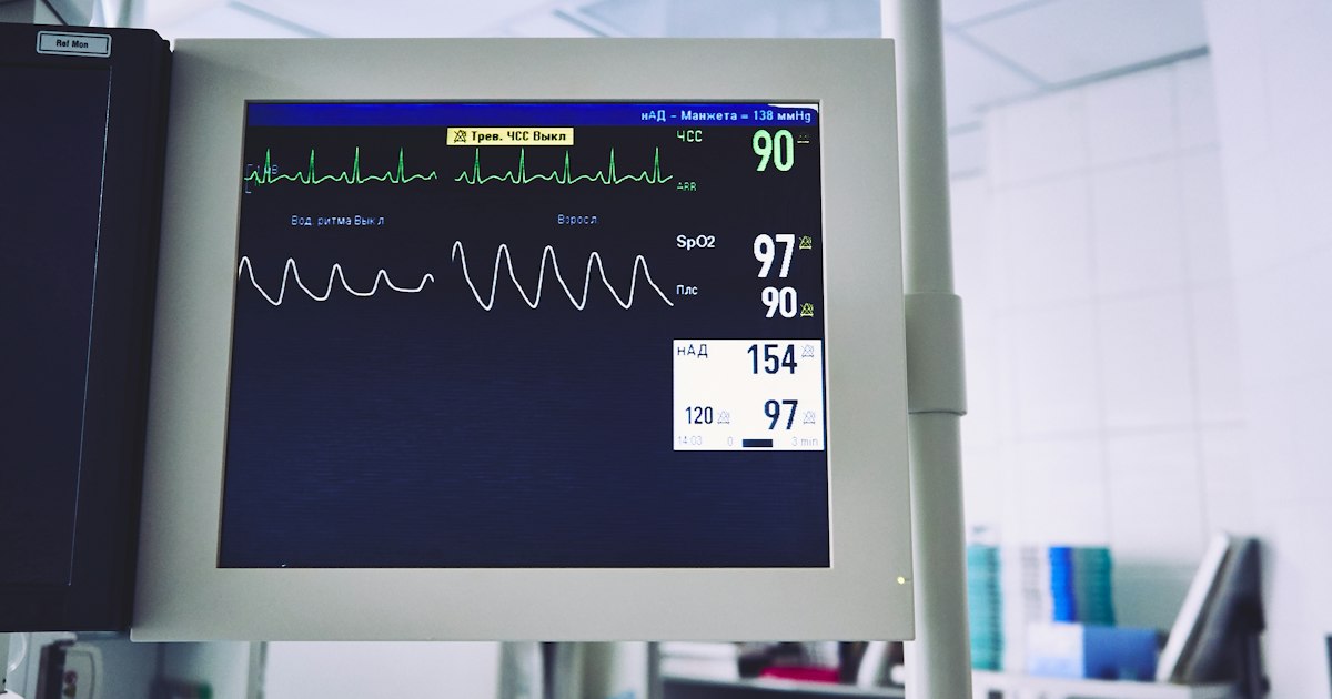 A doctor reviewing medical charts and imaging in a hospital setting
