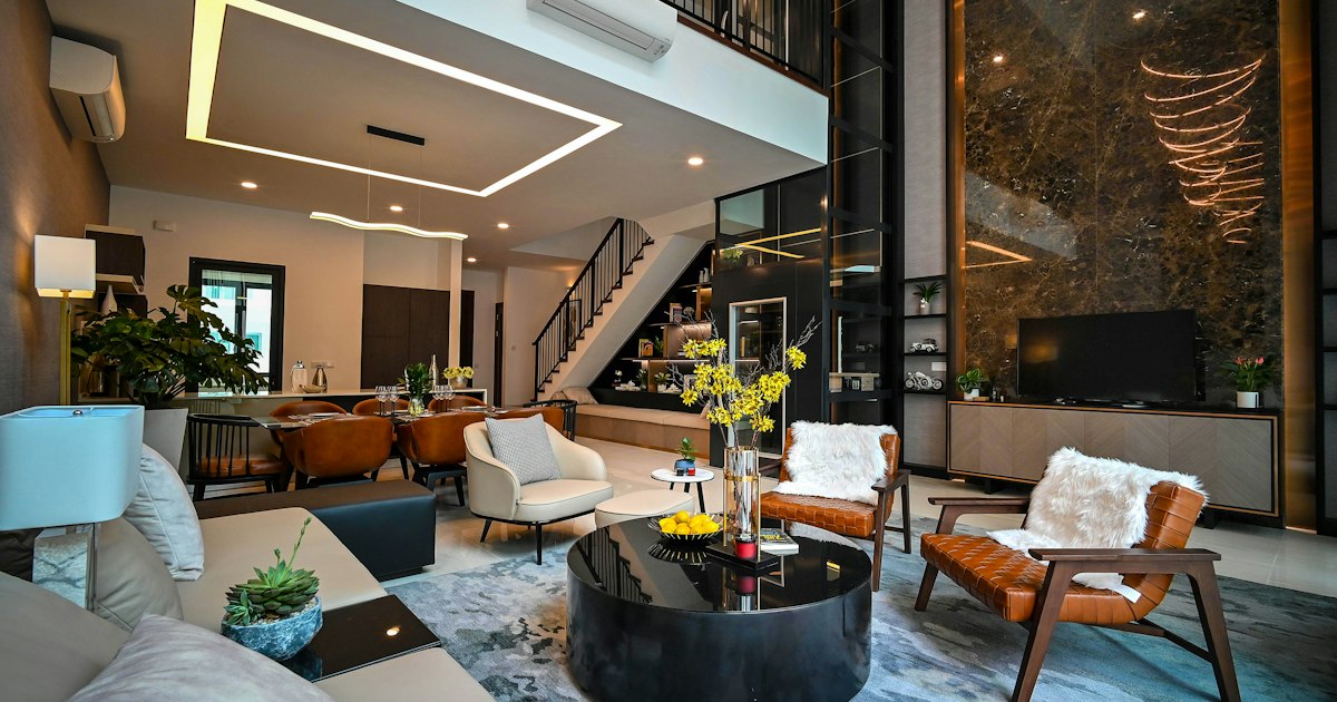 Modern hotel corridor and seating area where guests walk between the lobby and their rooms