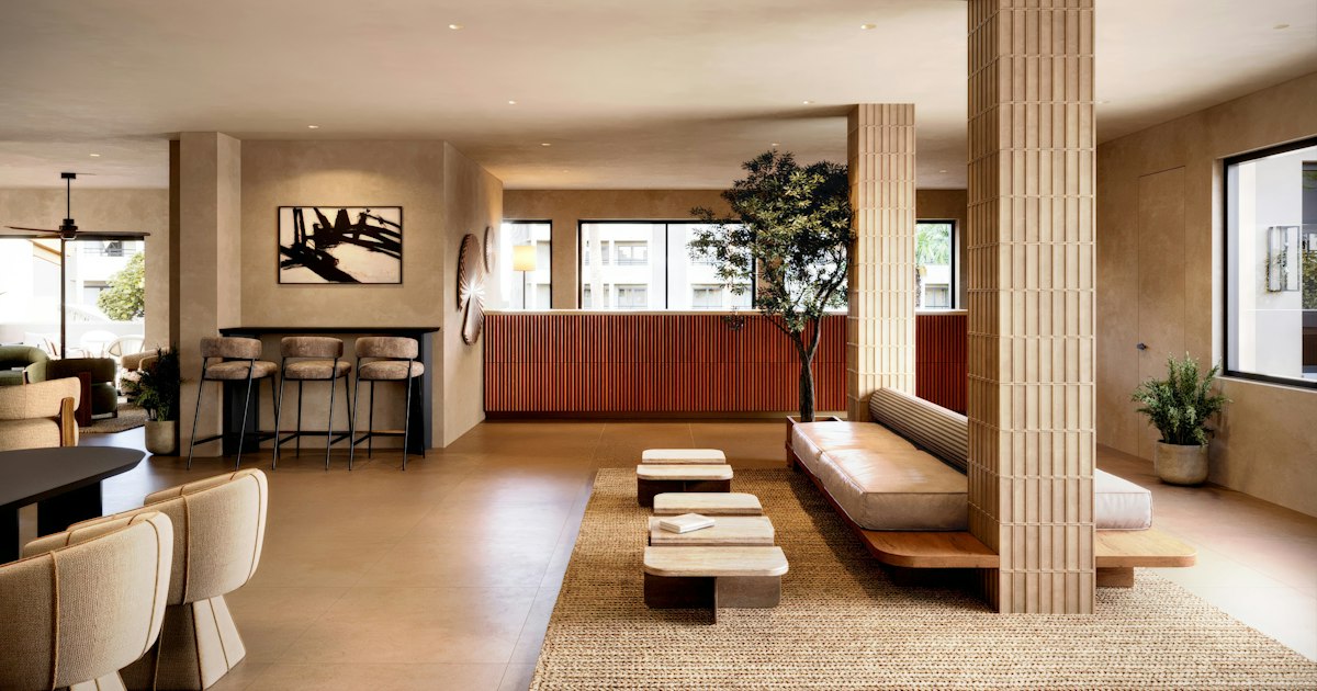 Spacious hotel lobby with a polished stone floor in downtown Cleveland during the busy holiday travel season