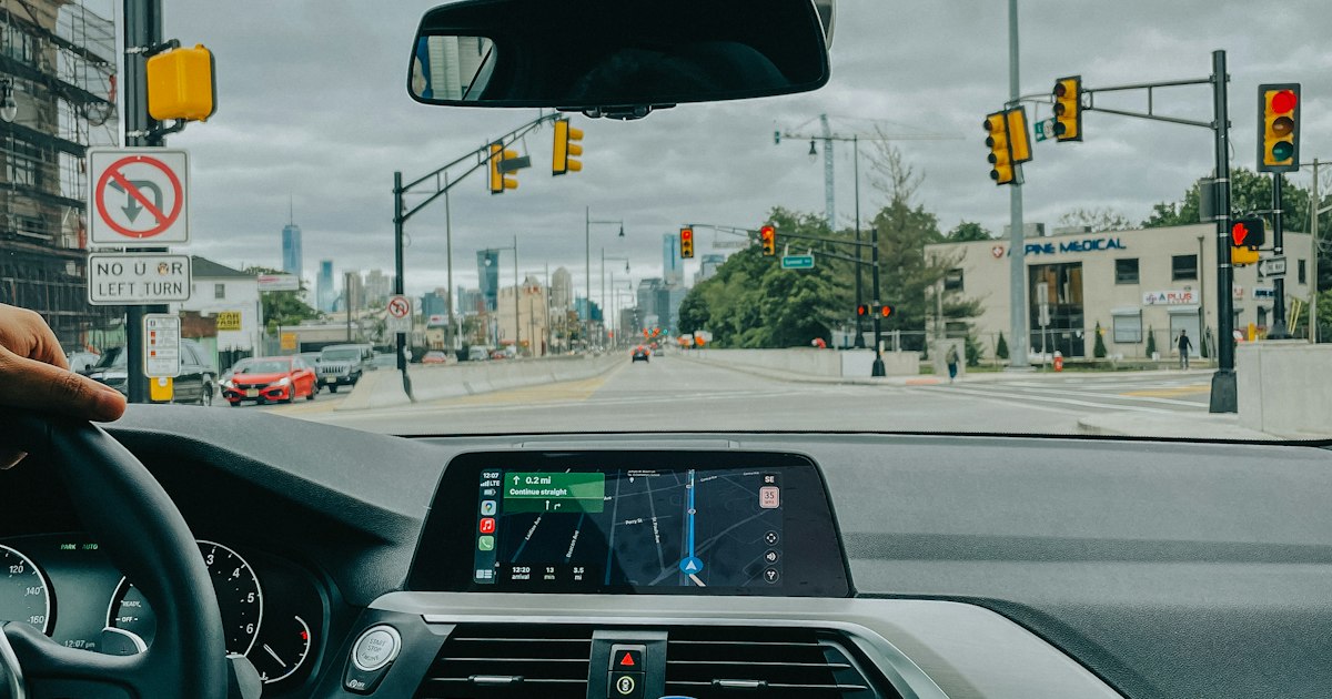 Rideshare driver turning onto a busy Cleveland city street after accepting a ride request