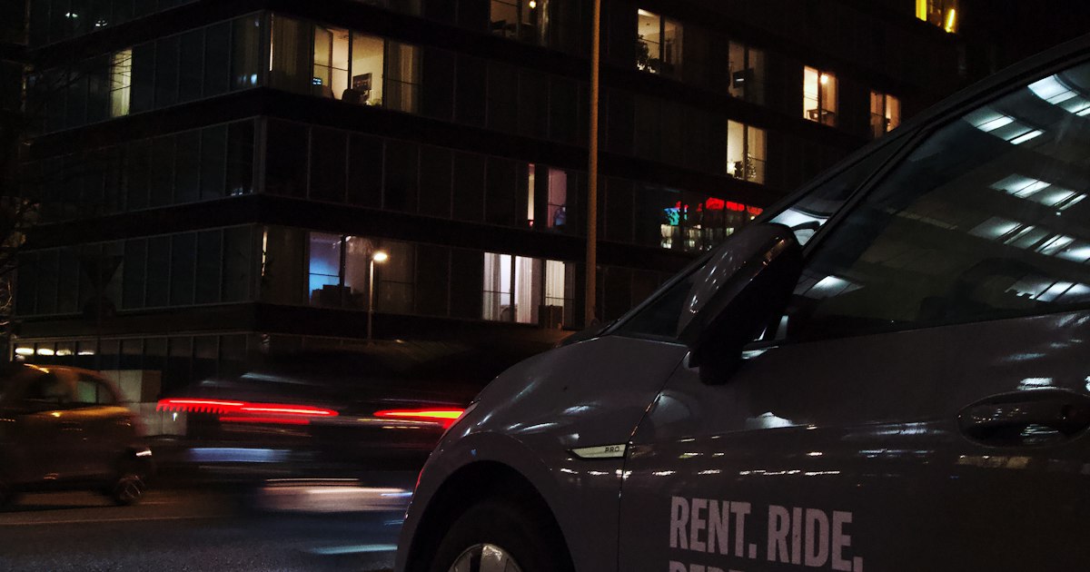 A car parked on a dark Cleveland roadside at night after a rideshare collision