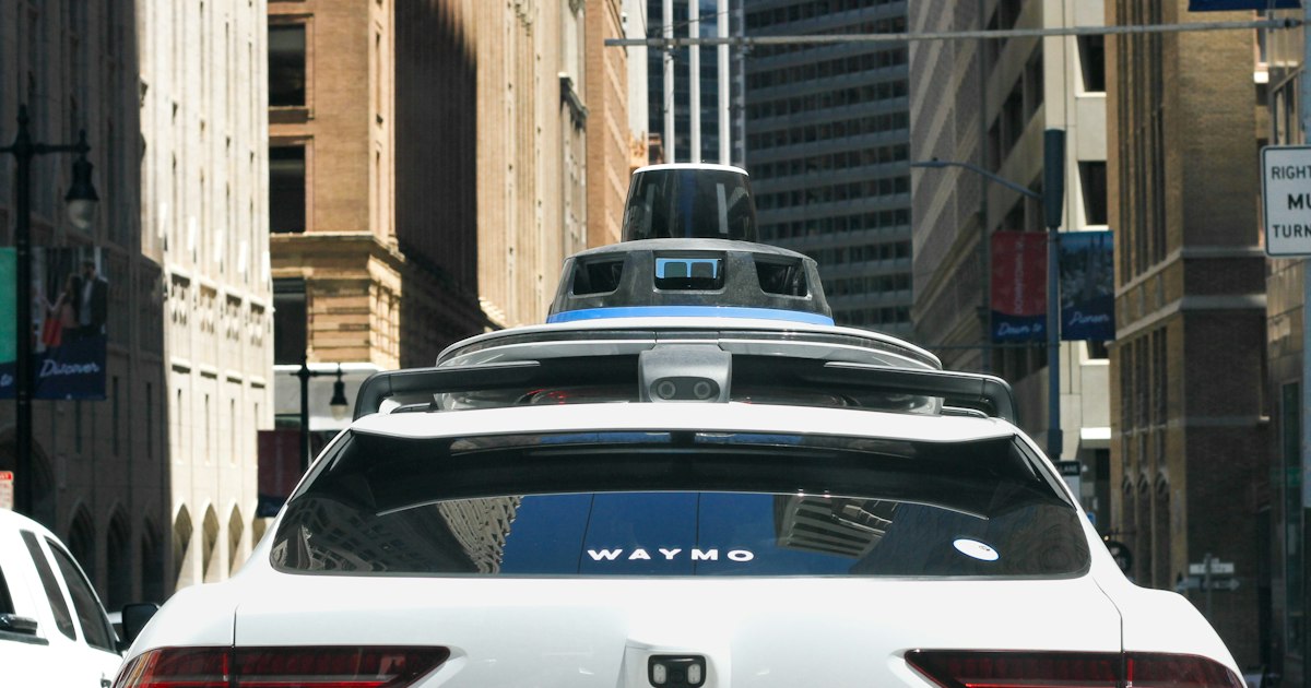 Interior view of a driverless vehicle with no one in the driver seat on a Cleveland area road