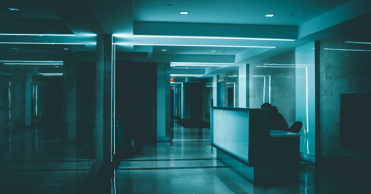A hospital ward seen down a long corridor, where downtime procedures are tested in a crisis